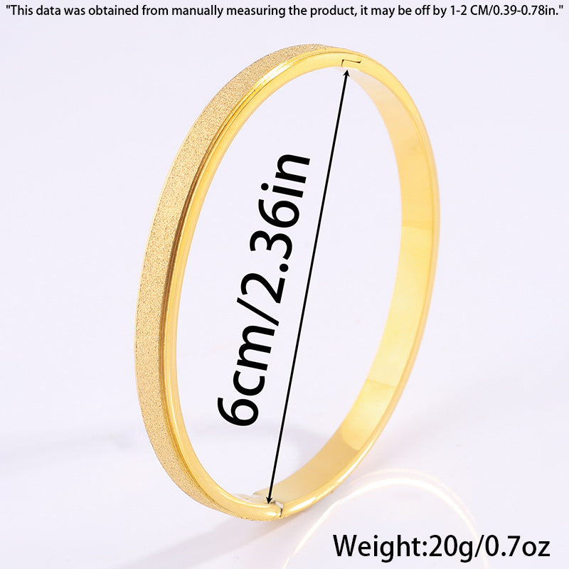 Pulsera de titanio con acabado dorado estelar