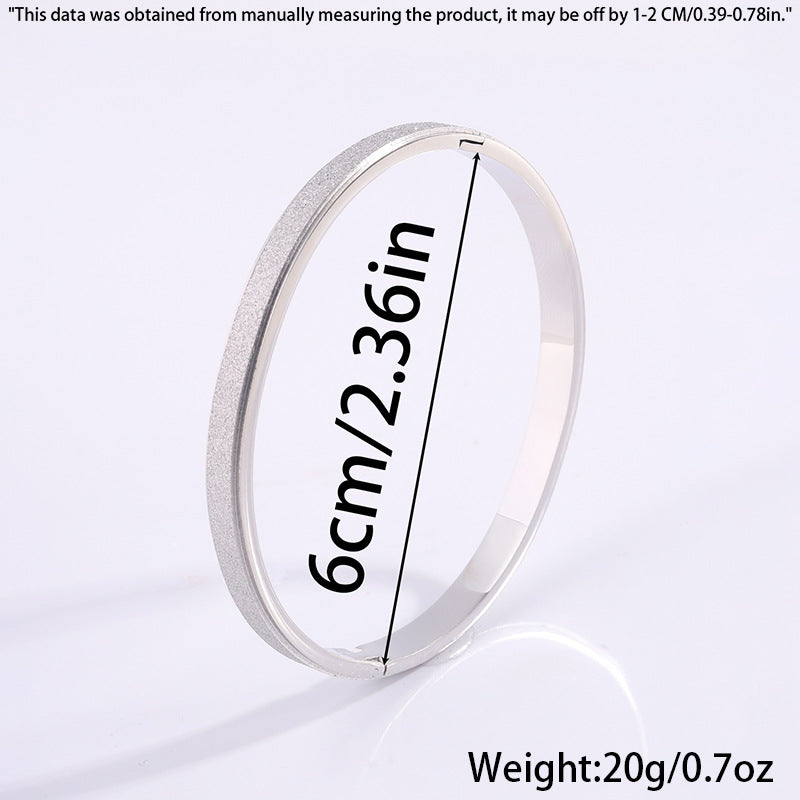 Pulsera de titanio con acabado dorado estelar